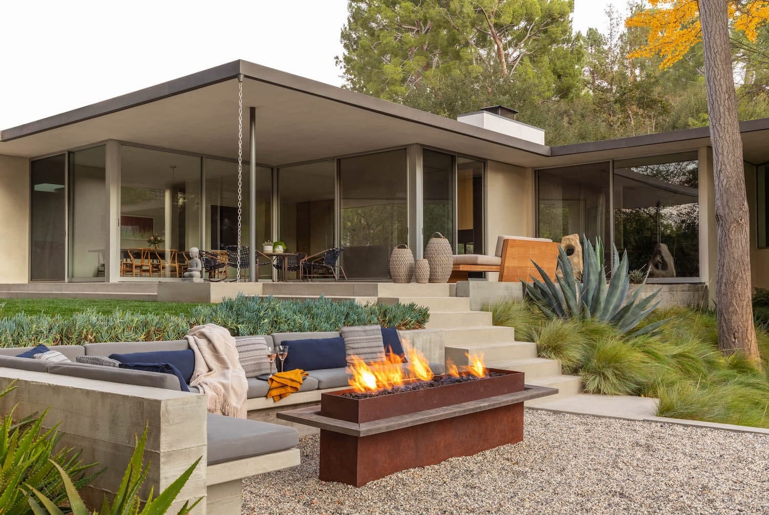 A mid-century home with a fire feature and landscaped grounds in Fryman Estates, Studio City.