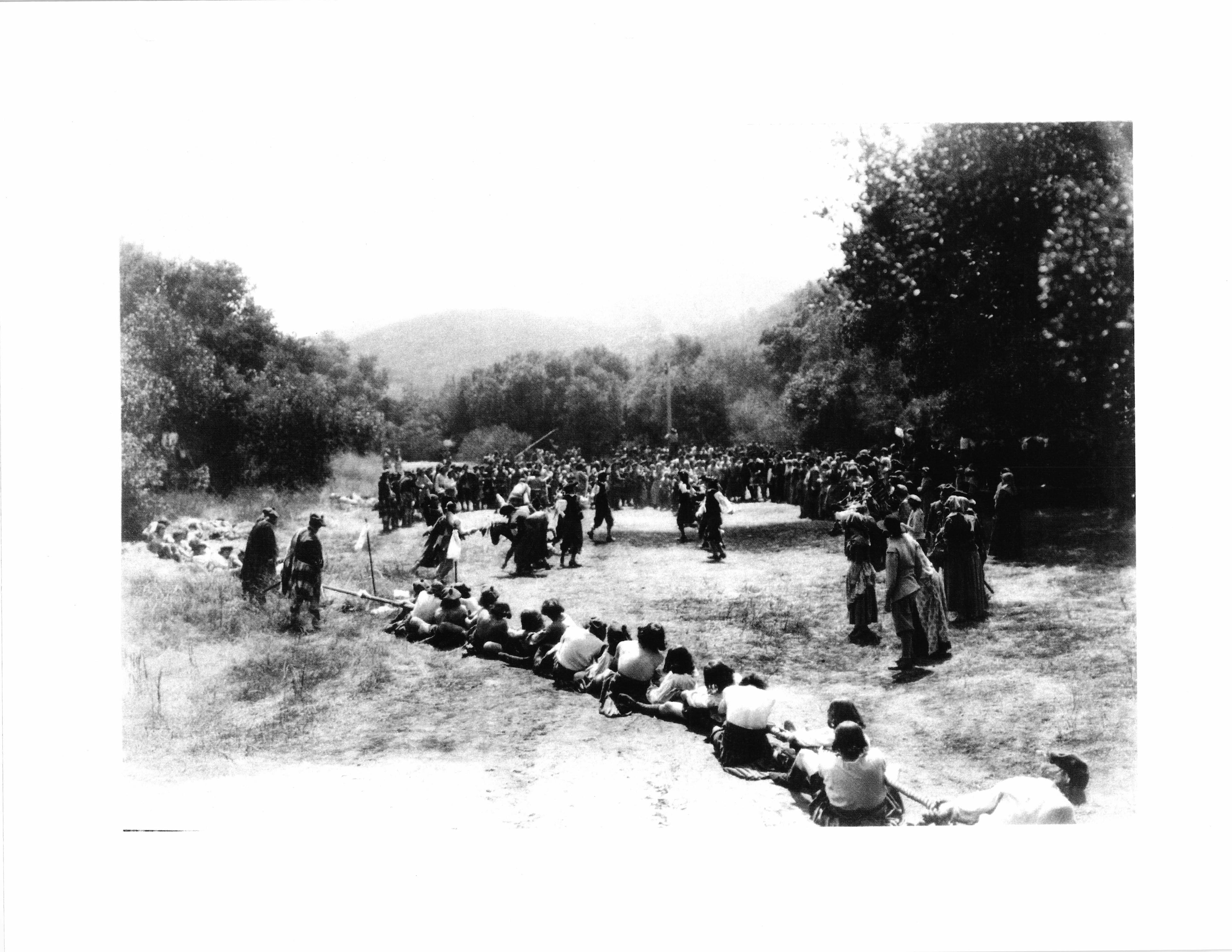People gathered in the open field at Fryman Ranch during filming.